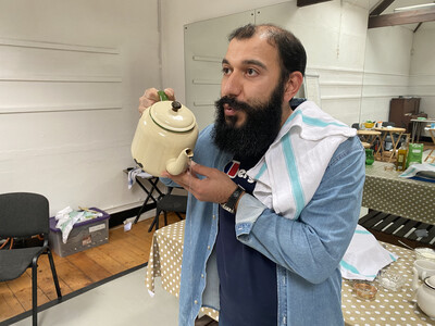man holding a teapot