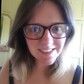 Head shot of Lana Burgess wearing glasses and smiling