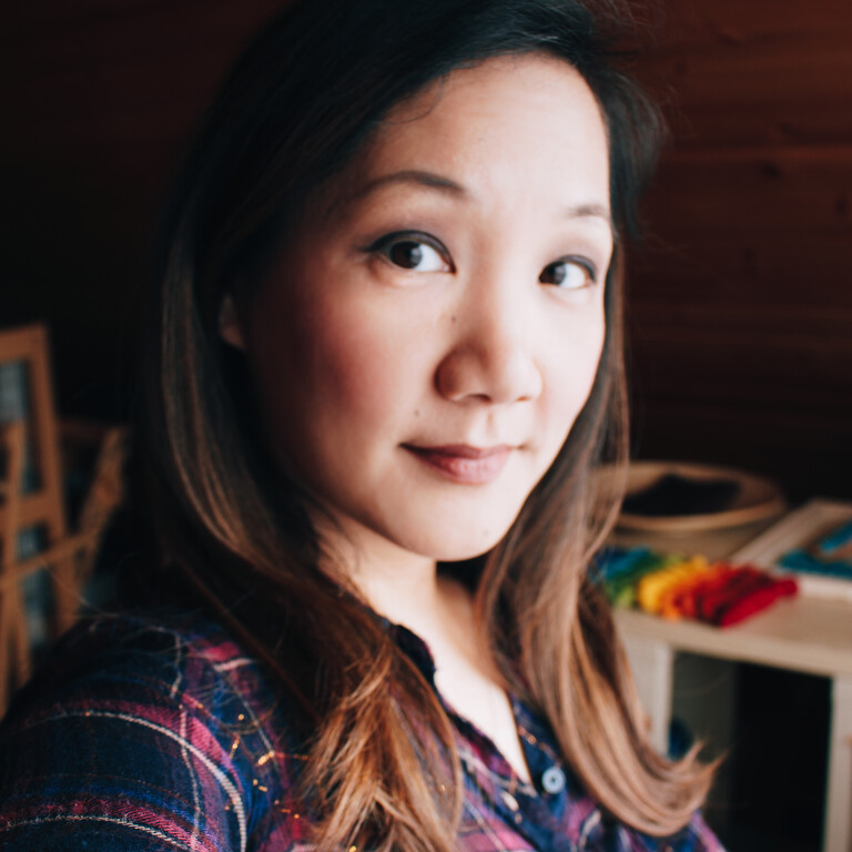 A head shot of Felicia Lo smiling in her studio