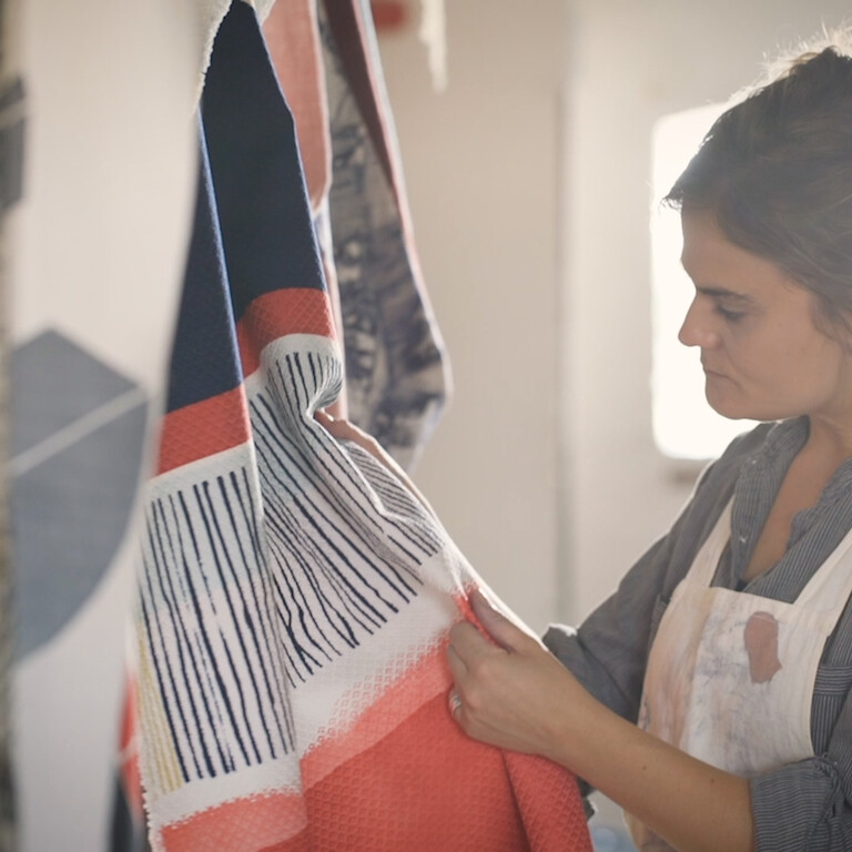 Alice Howard holding a printed fabric