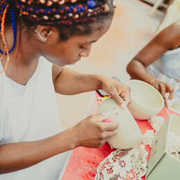 lady making a pottery bowl