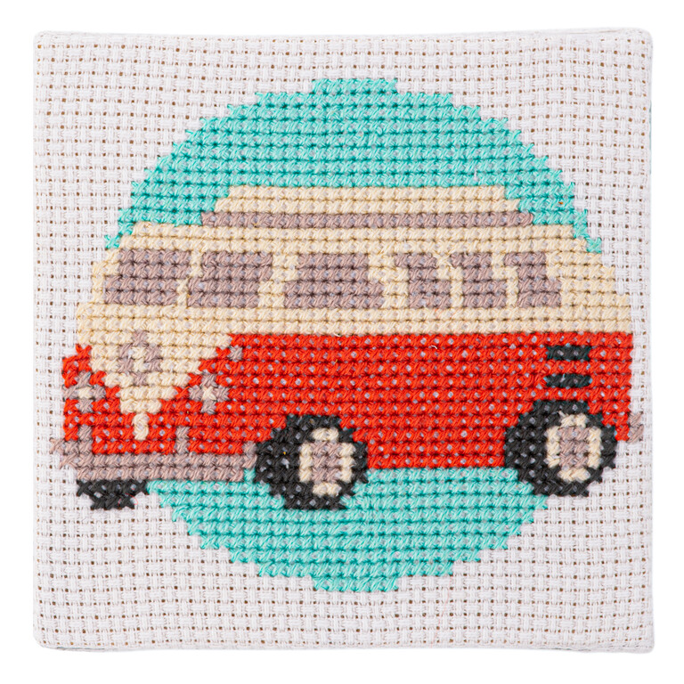 A cross stitched blue red and white camper van design