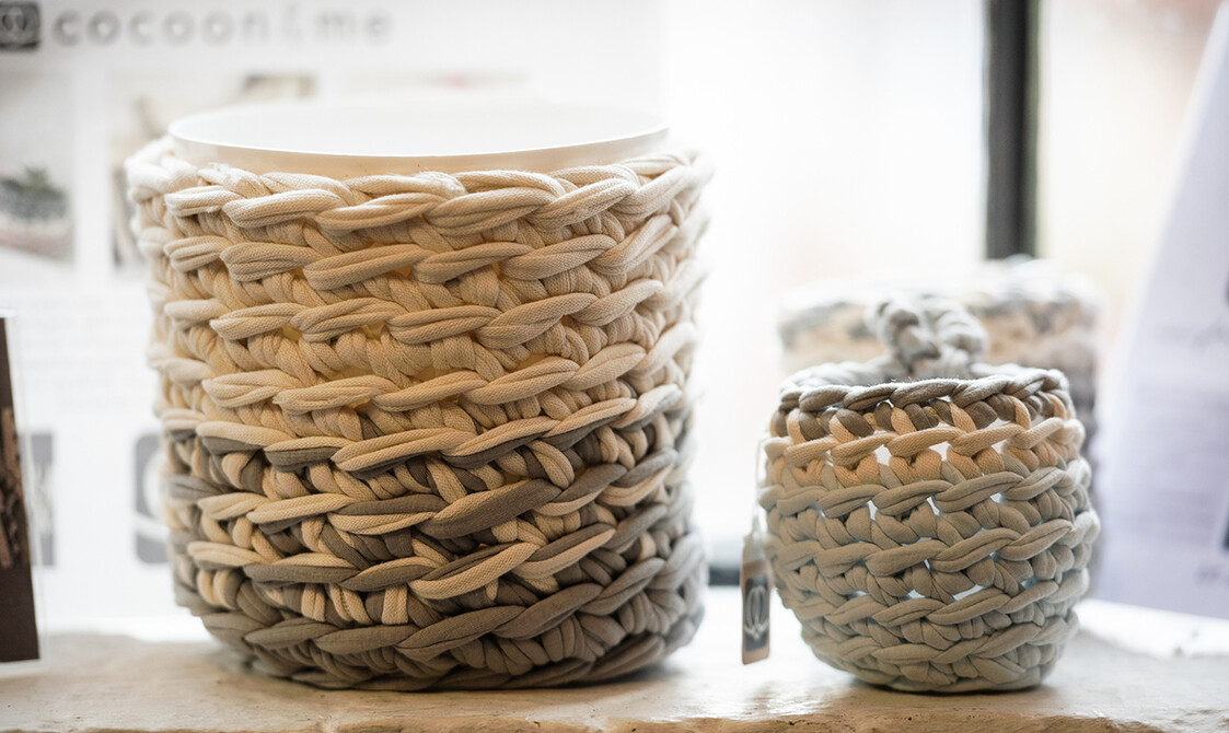 Image of woven baskets on a shelf in the Maltings Store