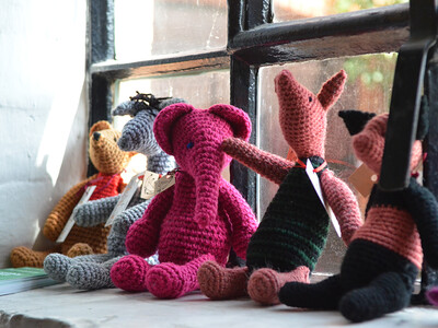 Knitted toys on a windowsill in the Maltings Store