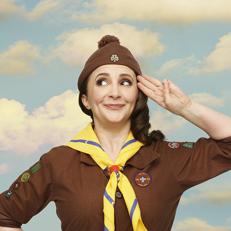 Promotion shot of comedian Lucy Porter dressed as a Girl Guide