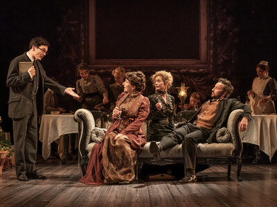 A group of actors perform on stage dressed in early 20th Century clothes during NT Lives 'Leopoldstadt'