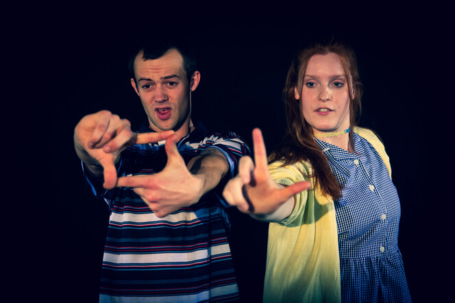 Characters Bobby and Amy making gestures with their arms outstretchced