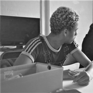 A black and white photo of Reuben Tyler Wilkinson looking away.