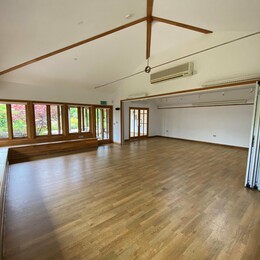 A large well lit studio room with wooden floors at the garden gallery