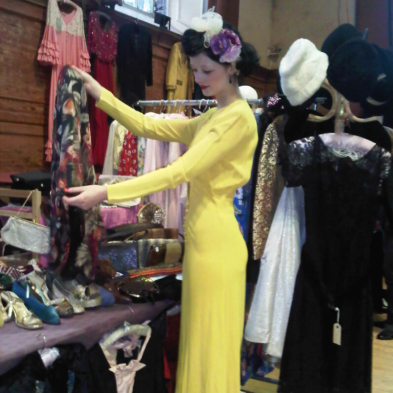 Woman dressed in vintage clothes browsing at the Vintage Fashion Fair