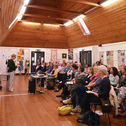 Workshop in progress in a wooden beamed Room with large vaulted ceilings