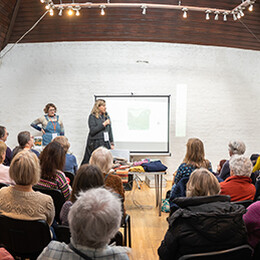 Fish eye perspective of A talk in progress in the Courtyard Kiln Room